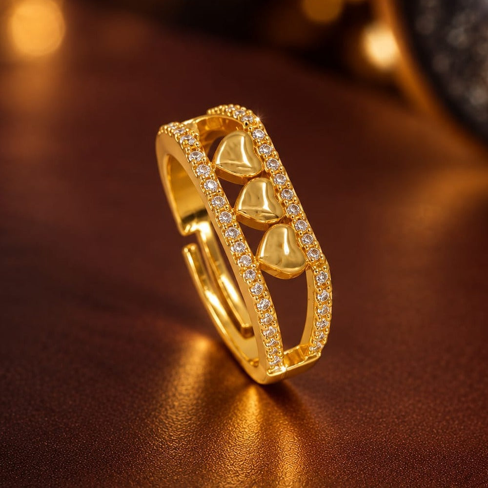 Triple Heart Ring - three gold hearts with stone rails